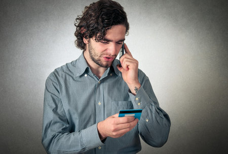 man using credit card on phone