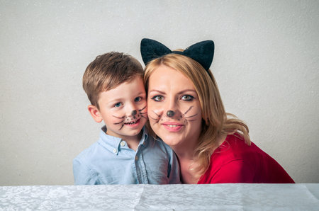 Happy boy with mum having funの写真素材