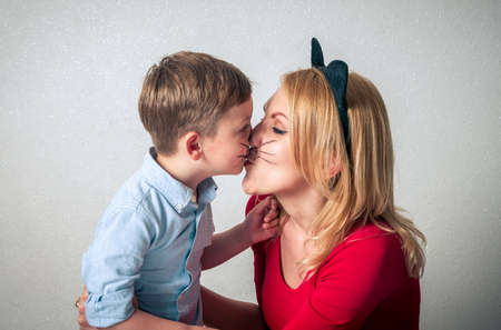 Happy boy with mum having funの写真素材