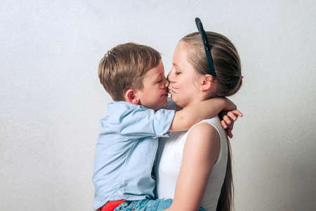 Happy boy with sister having funの写真素材