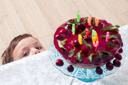 Little boy with the birthday cakeの写真素材
