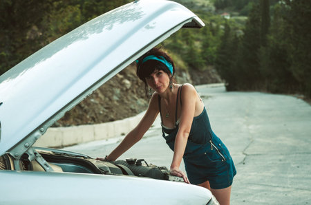 Woman checking the problems with the car