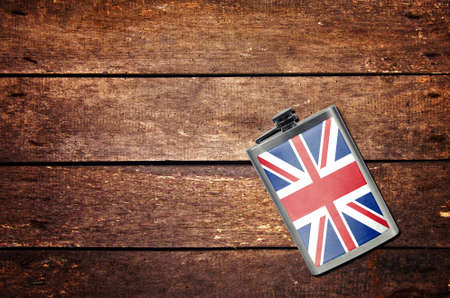 Alcohol flask on the table with flagの写真素材