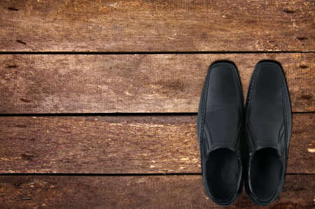 Black male shoes on tableの写真素材
