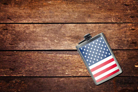 Alcohol flask on the table with flagの写真素材