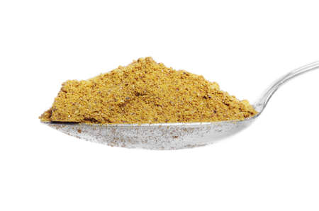 Curry powder on metal spoonの写真素材