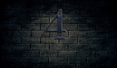Old house number sign on wall