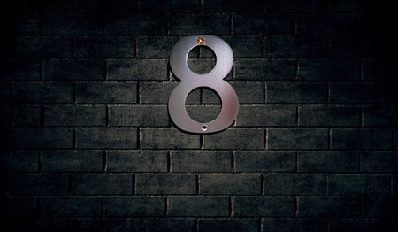 Old house number sign on wall