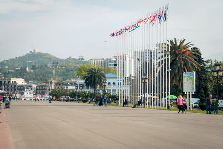 BATUMI, GEORGIA- April 14, 2018: People walking and having on Batumi boulevard.のeditorial素材