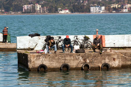 BATUMI, GEORGIA- April 1, 2018: Fishermen catching the fish in Batumi port.のeditorial素材