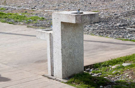 Water drinking fountain closeup on beachの写真素材