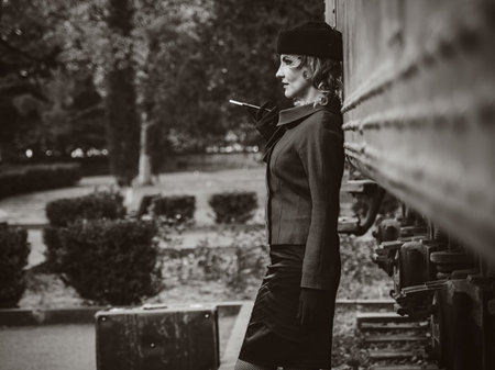Retro woman on the train station