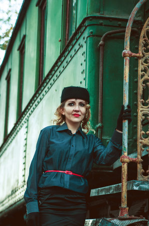 Retro woman on the train station