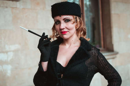 Retro woman on the train stationの写真素材