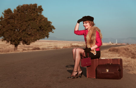 Retro beautiful blond woman portrait on road