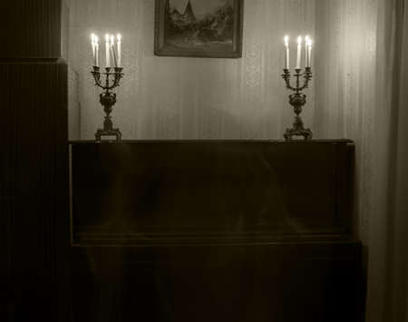 Ghost woman in room with candlesの写真素材