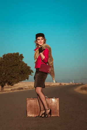 Retro beautiful blond woman portrait on road