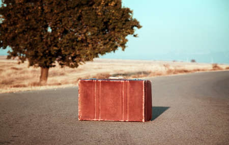 Vintage bag on the roadの写真素材