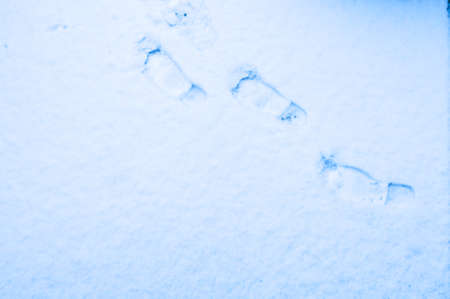 Abstract foot prints on the snowの写真素材