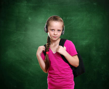 Young girl portrait with the school chalkboardの写真素材