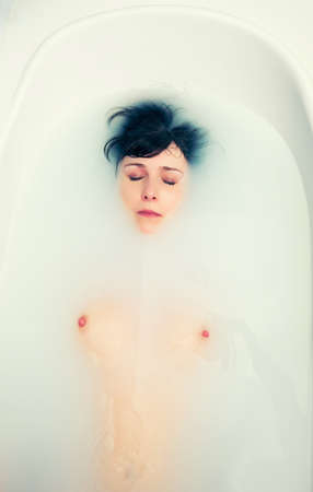 Woman relaxing in modern bathの写真素材