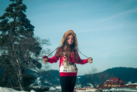 Girl having fun in the snow. Winter time