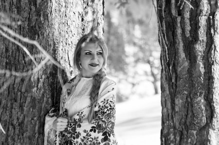 Woman portrait in the snow. Russian style