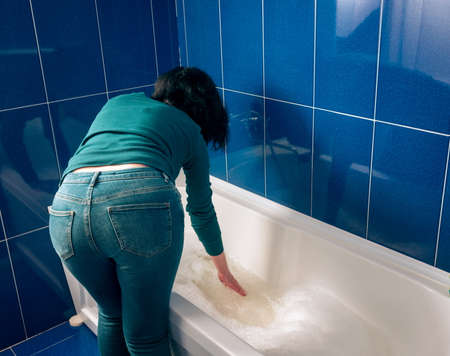 Casual girl preparing the bathroomの写真素材