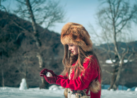 Girl having fun in the snow. Winter time