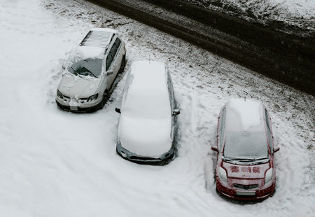 Cars covered with the snow