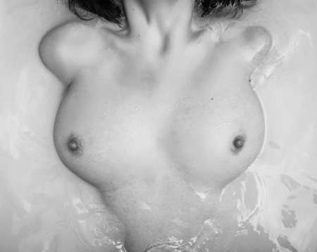 Woman relaxing in modern bathの写真素材