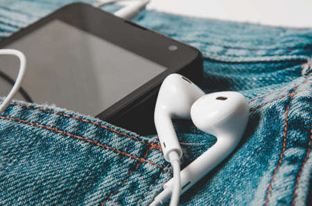 Phone in the jeans pocketの写真素材