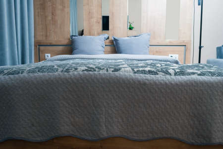 Bed in modern studio roomの写真素材