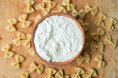 Baking ingedients. Flour and pasta on tableの写真素材