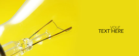 Lamp details on yellow background with copy space
