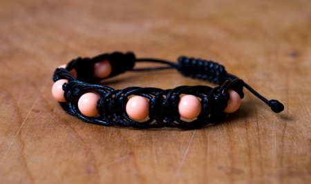 Bead bracelet on the wooden tableの写真素材
