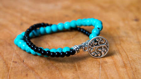 Bead bracelet on the wooden tableの写真素材