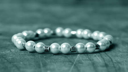 Bead bracelet on the wooden tableの写真素材