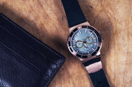 Business wristwatch on the wooden tableの写真素材