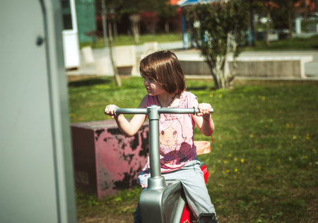 Small girl playing on the playground