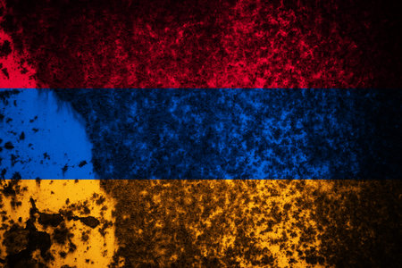 Old cracked wall with the flag paintedの写真素材