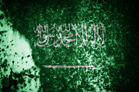 Old cracked wall with the flag paintedの写真素材