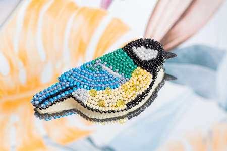 Bookmark for a book made of beads. Bead decoration. Handmade work. Read a book.の写真素材