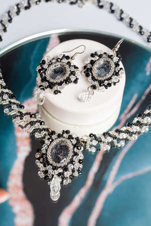 Bookmark for a book made of beads. Bead decoration. Handmade work. Read a book.の写真素材