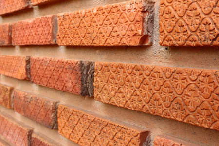 engraved on brick in the wall are closeupの写真素材