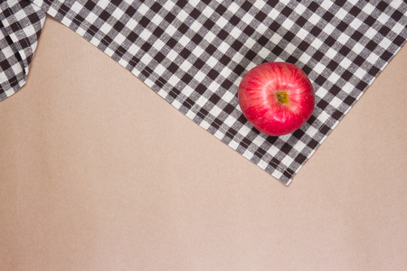 apple on brown table striped Fabric and brown paper backgroundの写真素材