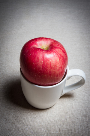an apple on a cupの写真素材