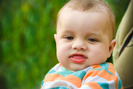 Cute kid on a green backgroundの写真素材