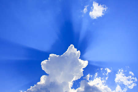 Clouds with the rays on a blue skyの写真素材