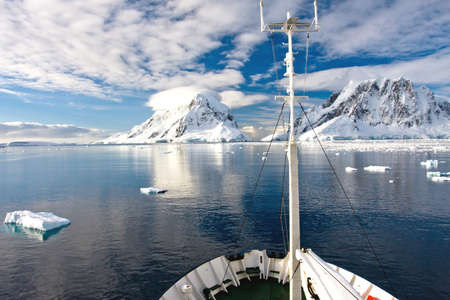 Beautiful snow-capped mountains against the blue skyの写真素材
